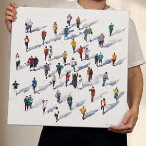 May include: A square canvas painting featuring a multitude of small, stylized figures in various colorful outfits walking across a white background. Each figure casts a long, diagonal gray shadow, creating a sense of movement and depth across the surface.