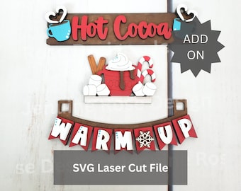 Könnte beinhalten: SVG-Laserschneidedatei für eine Weihnachtsdekoration zum Thema heiße Schokolade. Das Design beinhaltet ein Banner mit der Aufschrift "Warm Up" mit einem Schneeflocken in der Mitte, eine Tasse heiße Schokolade mit Marshmallows und einem Zuckerstange sowie ein Banner mit der Aufschrift "Heiße Schokolade" mit einem Herz und einer Tasse an jedem Ende.