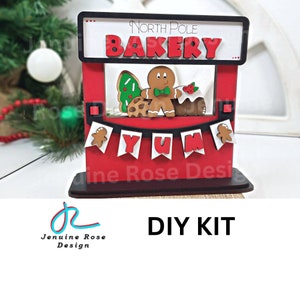 North Pole Bakery Stand DIY Kit, Unfinished Wooden Interchangeable Stand for Christmas Shelf Sitter with Christmas Cookies & Gingerbread Man