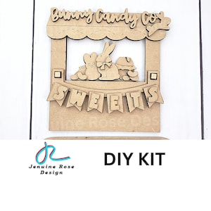 May include: DIY kit for a bunny candy co. wooden sign. The sign features a bunny with a bow tie and the words "Bunny Candy Co." and "Sweets" on a banner.
