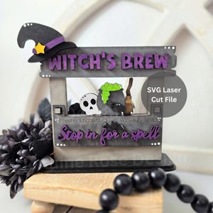 May include: A Halloween-themed wooden sign with the text "Witch's Brew" in purple letters. The sign features a witch's hat, a skull, a cauldron with green bubbling liquid, and the phrase "Stop in for a spell". The sign is a laser cut file.