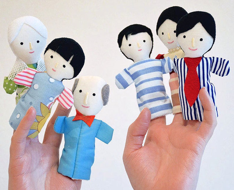 Family of six finger puppets with light skin color.