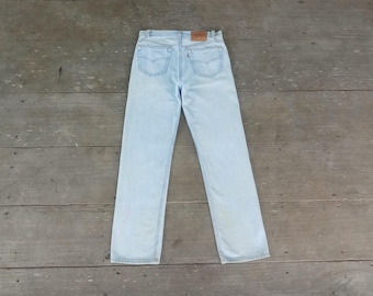 Vintage Levi's 501 W32 L31: Faded ,ripped,USA made