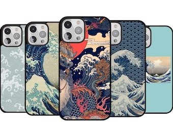 May include: A selection of phone cases with Japanese art designs. The cases display stylized waves, a dragon, and a red sun. They have black borders and are in shades of blue, beige, and red.