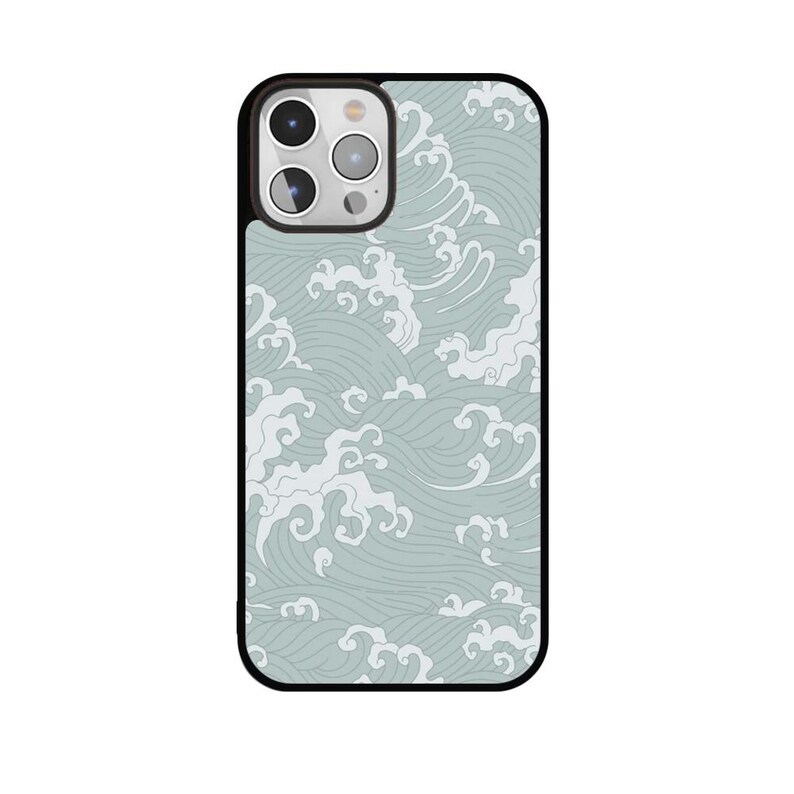 May include: A smartphone case with a black border and a light blue and white wave pattern. The case has a camera cutout on the upper left side. The wave design is a repeating pattern of stylized ocean waves.