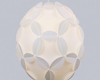 May include: A white pendant light fixture with a round, spherical shape. The fixture is made of many overlapping, white, petal-like shapes.