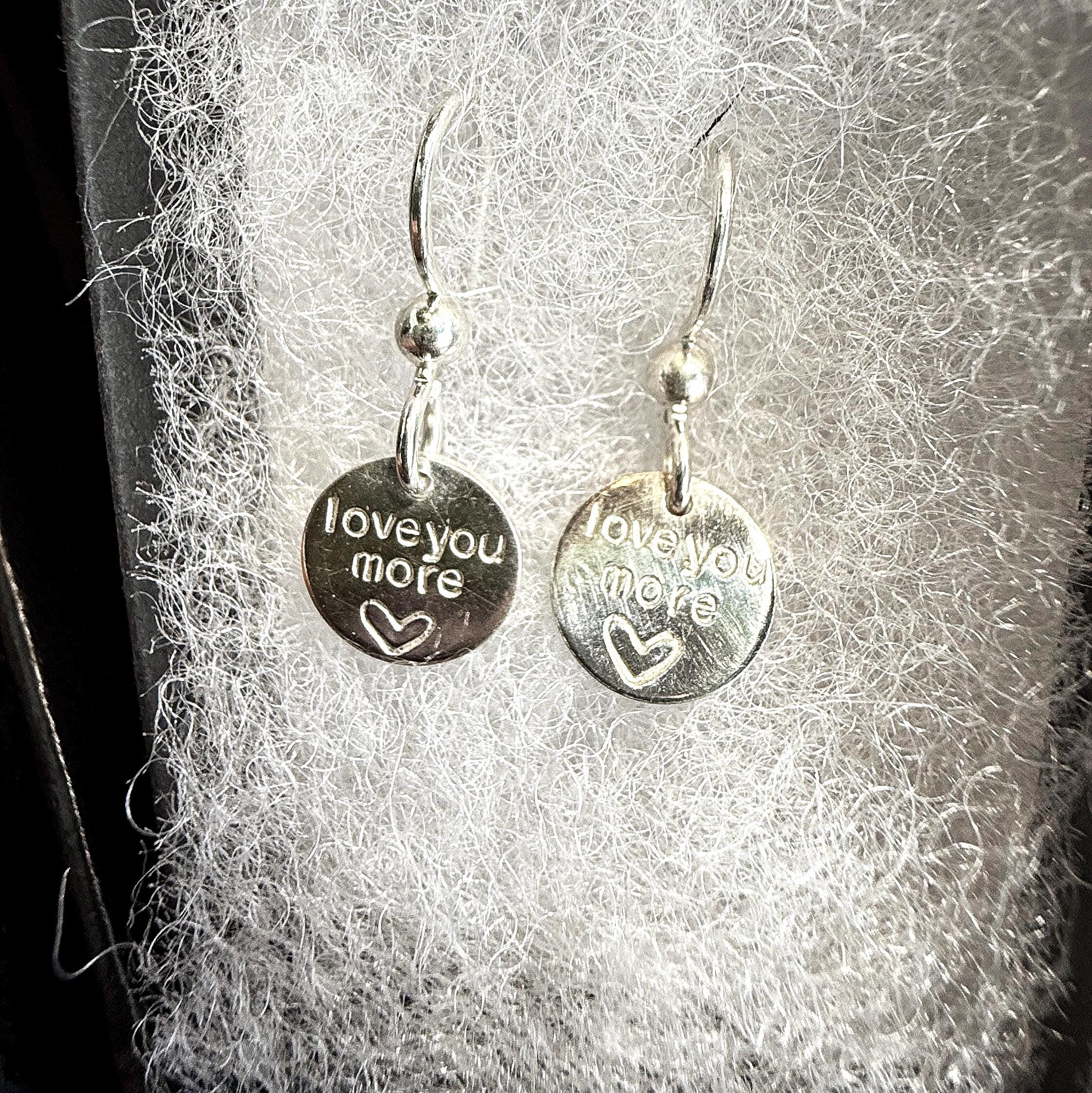 Sterling silver heart disc earrings. Sterling silver heart disc earrings.