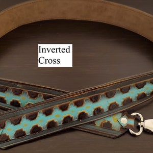 May include: A brown and turquoise leather bag strap with silver clasps. The strap has a repeating pattern of turquoise and brown shapes. The text "Inverted Cross" is visible on the image.