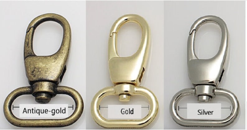 May include: Three metal swivel clasps in antique-gold, gold, and silver finishes. Each clasp has a lobster claw style hook and a D-ring base. The image shows the colour variations available.