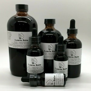 May include: Four glass bottles of lemon balm tincture in various sizes. The bottles are labeled "Lemon Balm" and "Pure Health Botanicals". The largest bottle is 16 fluid ounces and contains 40% alcohol.
