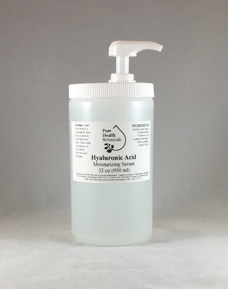 May include: A clear plastic bottle with a white pump dispenser filled with a clear liquid. The bottle is labeled "Hyaluronic Acid Moisturizing Serum 32 oz (950 ml)" and "Pure Health Botanicals". The ingredients are listed on the bottle.
