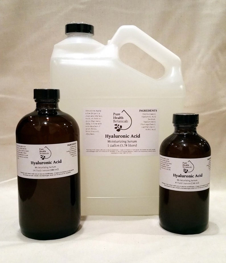 May include: Three brown glass bottles of Hyaluronic Acid moisturizing serum, with labels that say "Pure Health Botanicals". The bottles are in different sizes: 16 fluid ounces, 8 fluid ounces, and 1 gallon.