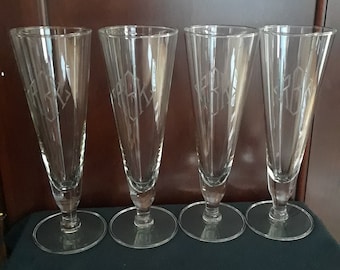 A set of 4 pilsners/ beer glass with RBK monogram on bowl.