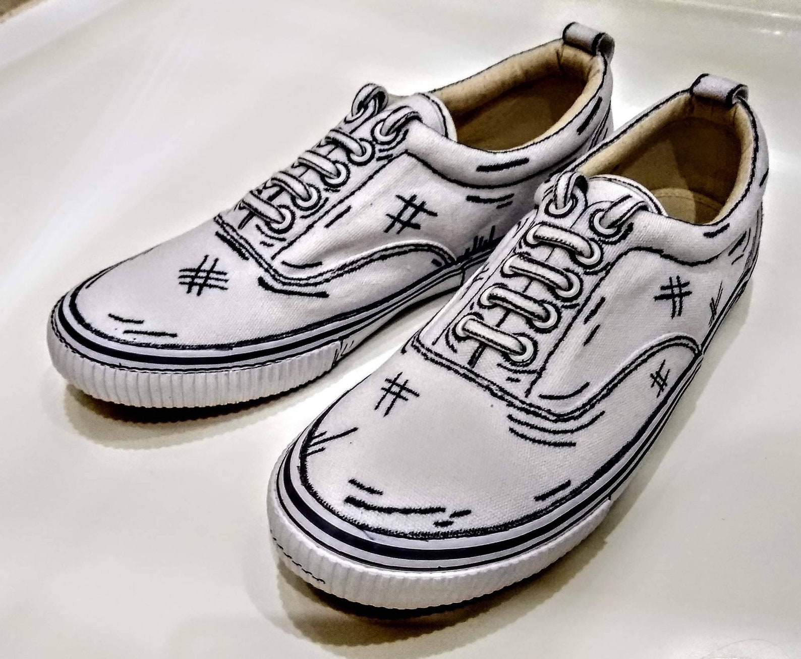 OVERSIZED SNEAKERS IN WHITE CALFSKIN CARTOON FIGURE BLACK TRIM LACES