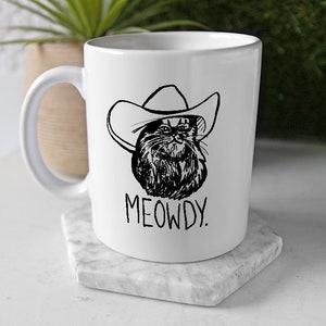 Meowdy Texas Cat Meme Mug // Texan Cat Meme Gifts // Funny Howdy Meowdy Meme Mashup Mug for Texan People // Cowboy Cat with Hat Art