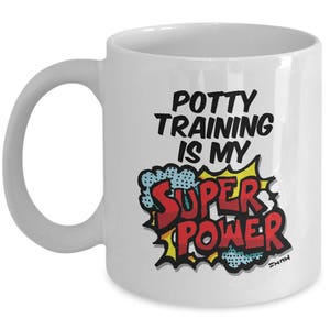 May include: White ceramic coffee mug with a black and red graphic that says "Potty Training is my Super Power".