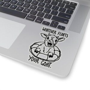 May include: A black and white sticker with a cartoon goat wearing a life preserver and the text "Whatever floats your goat."
