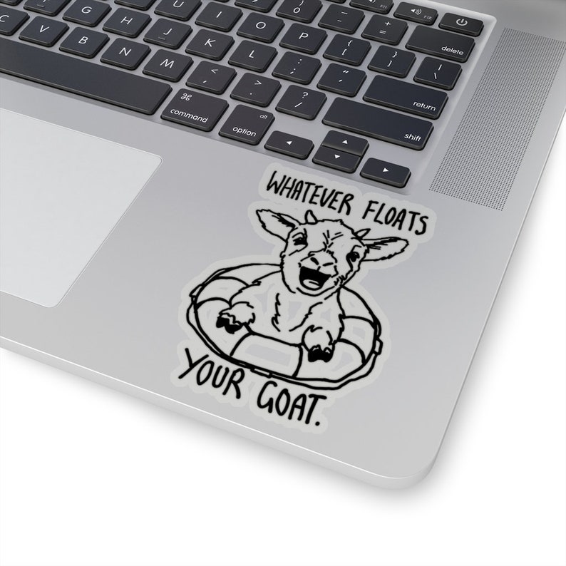 May include: A black and white sticker with a cartoon goat wearing a life preserver and the text "Whatever floats your goat."