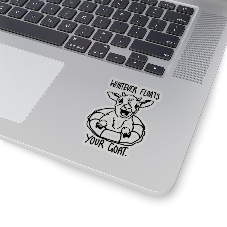 May include: A black and white sticker with a goat wearing a life preserver and the text "Whatever floats your goat."
