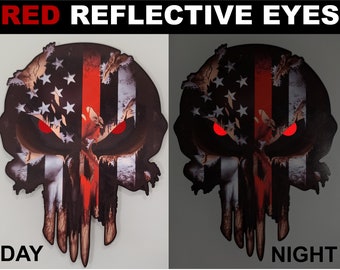 May include: A red, white and blue American flag skull with a red stripe down the centre. The skull's eyes are red and reflective. The image shows the skull in both daylight and nighttime conditions.