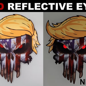 May include: A red, white, and blue American flag skull sticker with a yellow Donald Trump hair style. The skull has red reflective eyes that glow in the dark. The sticker says "RED REFLECTIVE EYES" at the top and "DAY" and "NIGHT" at the bottom.