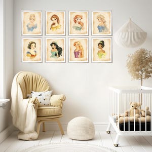 May include: A set of eight framed prints featuring Disney princesses. Each print has a watercolor background and features a different princess with a light brown frame.
