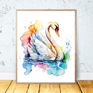 Puede incluir: Pintura acuarela de un cisne blanco nadando en un lago con salpicaduras de pintura coloridas en el fondo.