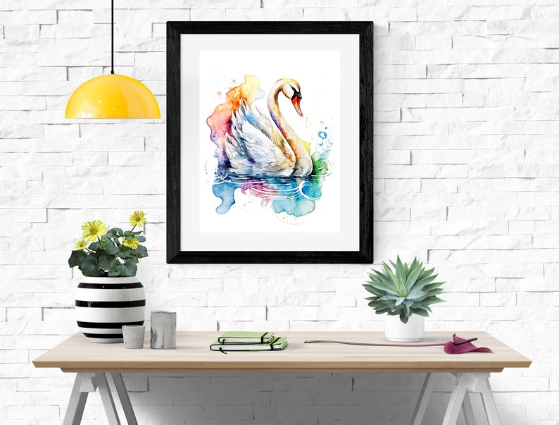 Puede incluir: Una pintura de acuarela enmarcada de un cisne blanco nadando en una escena de agua abstracta y colorida. El cisne est&aacute; mirando hacia la izquierda y tiene la cabeza girada hacia la derecha. El agua est&aacute; pintada en tonos de azul, verde, rosa y morado.