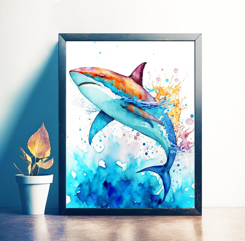 Puede incluir: Pintura acuarela de un tibur&oacute;n azul y naranja saltando fuera del agua con salpicaduras de color a su alrededor.