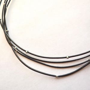 Black leather cord necklace with silver toned crimp beads, 30 inch long delicate double strand necklace