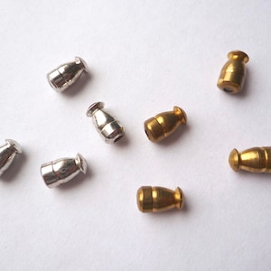 40 brass or silver tone stick pin clutches, Bulk vintage bullet pin stoppers
