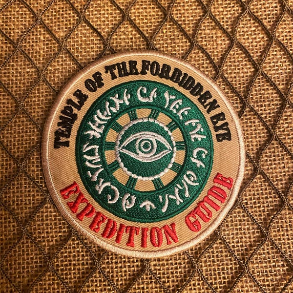 Patch de expedição do Templo do Olho Proibido
