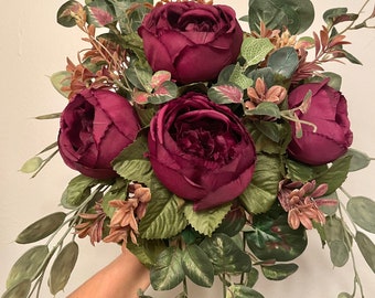 Burgundy + Terracotta Bridal Bouquet with eucalyptus and begonia greenery. Cascading Cabernet Bouquet with Matching Corsage and Boutonniere.