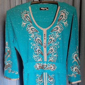 Beautiful Rimass Mod turquoise dress with sparkle, adorned with gold trim, embroidery,  beads and gems in excellent condition,  size says 46