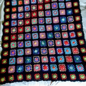 Excellent condition on the hand made crocheted granny square throw quilt, baby blanket