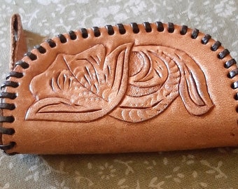 Small hand tooled leather zippered coin purse with  finger handle in excellent condition