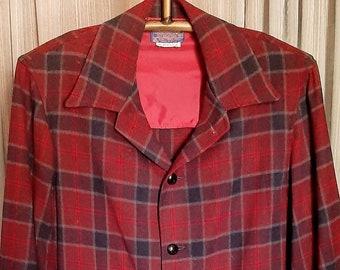 Reds, grays and black 100% Virginia wool Pendleton sports jacket in excellent condition.  Button cuffs and front closure.  2 front pockets M