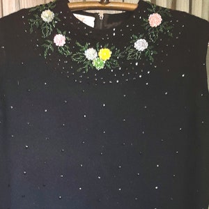 Beautiful black wool shell top,  hand embroidered flowers of sequins and beads in excellent condition,  size M