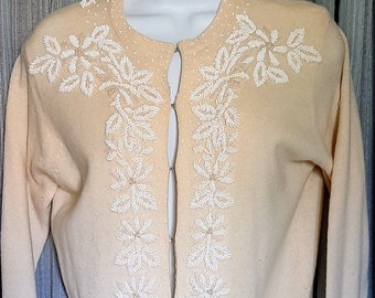 Off white 50s hand beaded CynLes wool sweater, hook and eye front closure in excellent condition, size 38