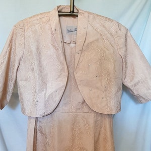 Gorgeous 2 piece Adrian Tabin light pastel lace dress and cover with rhinestone embellishments in excellent condition,  sixe med