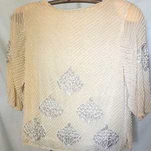 Beautiful ivory beaded holiday top in excellent condition,  size small