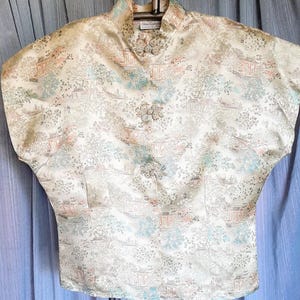 Beautiful China Trading Co. sleeveless blouse, front frog closure, beautiful silky fabric.  armpit to armpit is 23 inches.  36 inch waist.