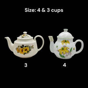 May include: Two white ceramic teapots with floral designs. One teapot features sunflowers, the other has yellow and purple flowers. The text "Size: 4 & 3 cups" is at the top. The teapots are labeled "3" and "4".
