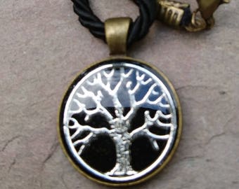 resin embedded silver plated 'tree of life' set in bronze alloy setting