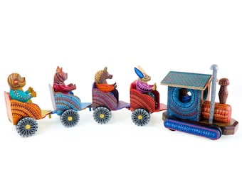 May include: A colourful wooden toy train with animal figures. The train has a blue engine with a green roof and a chimney. The carriages are decorated with geometric patterns and feature a monkey, a pig, a horse, and a rabbit.