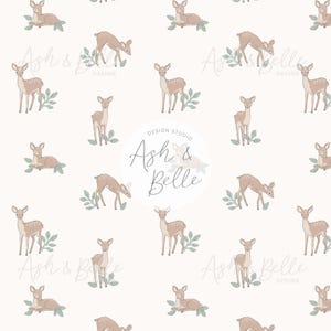 May include: A repeating pattern on a white background featuring light brown fawns with white spots, each accompanied by small green leaves. A circular logo in the center displays the text Ash & Belle Design Studio in a script and sans-serif font.