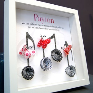 May include: A white framed picture with the name "Payton" at the top. The quote "We can't always choose the music life plays for us, but we can choose how we dance to it." is printed below the name. The picture features five paper butterflies and five paper flowers in black and white.