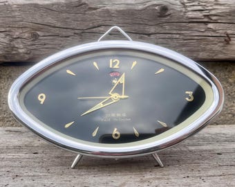 Sveglia vintage a forma di gallo dorato: MCM, forma futuristica dell'occhio