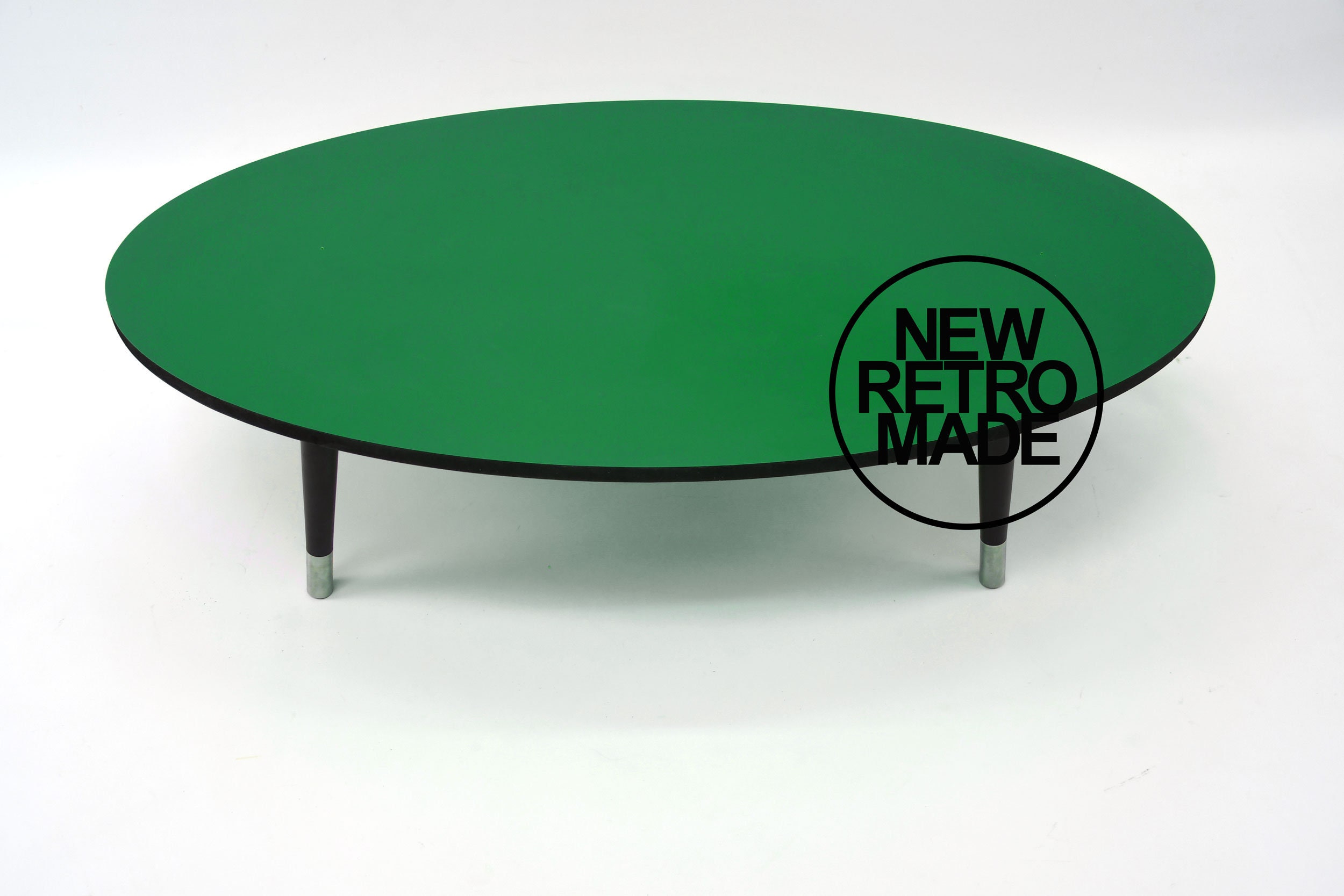 Oval Coffee Table With Black Edge, Tapered Legs and Stainless Steel