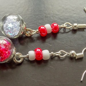 Red and white snow globe like sphere earrings